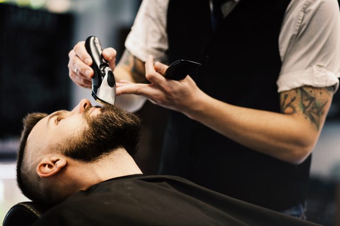 Professional barber doing a haircut