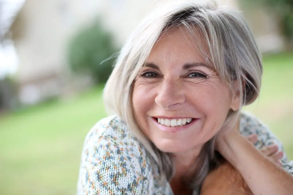 senior mature woman with gray long hair