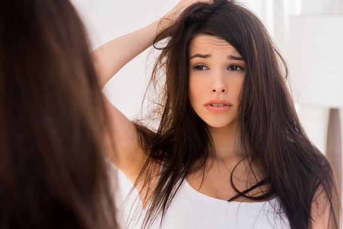 woman holding her hair