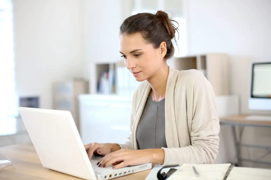 woman with long hair working from home