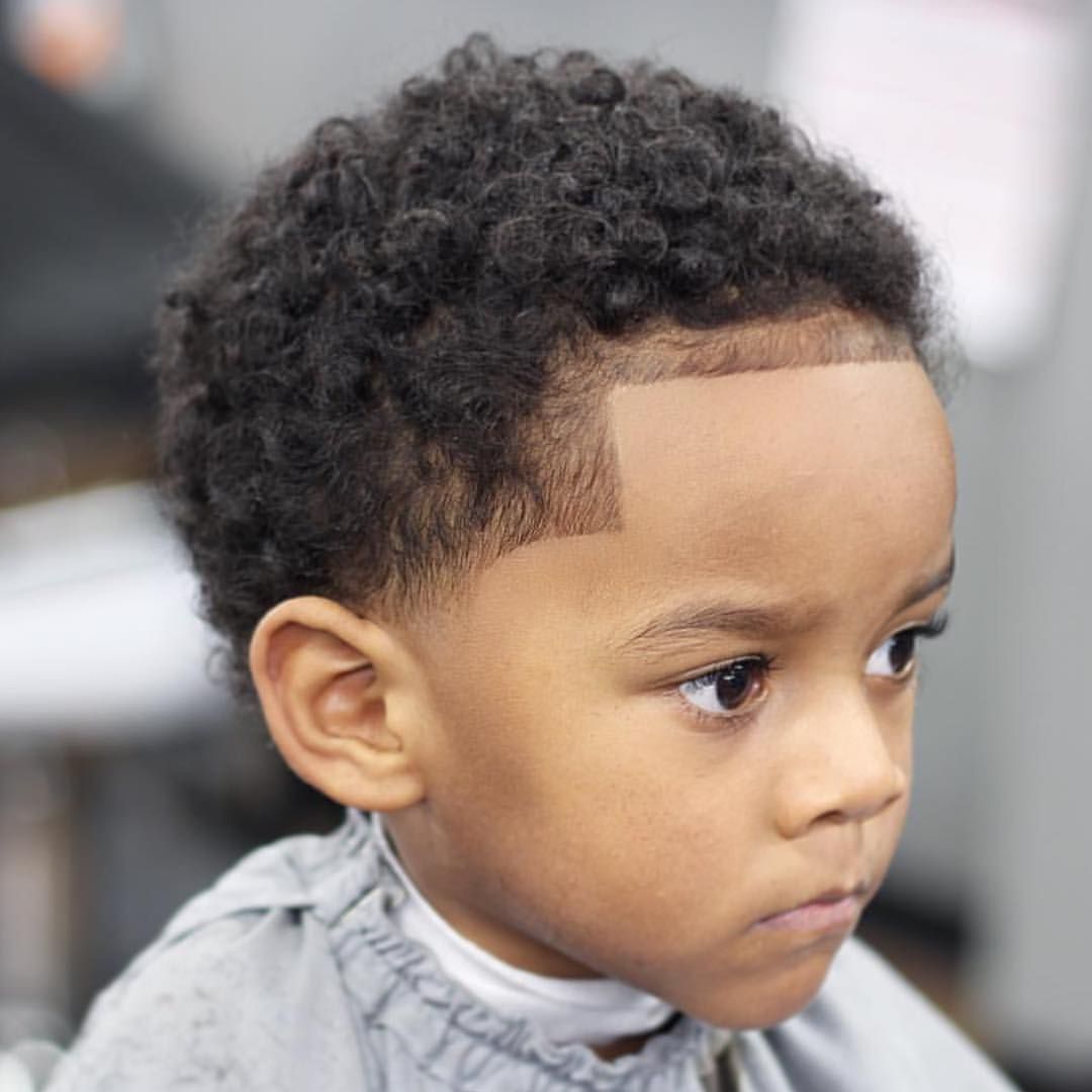Afro American baby boy first haircut
