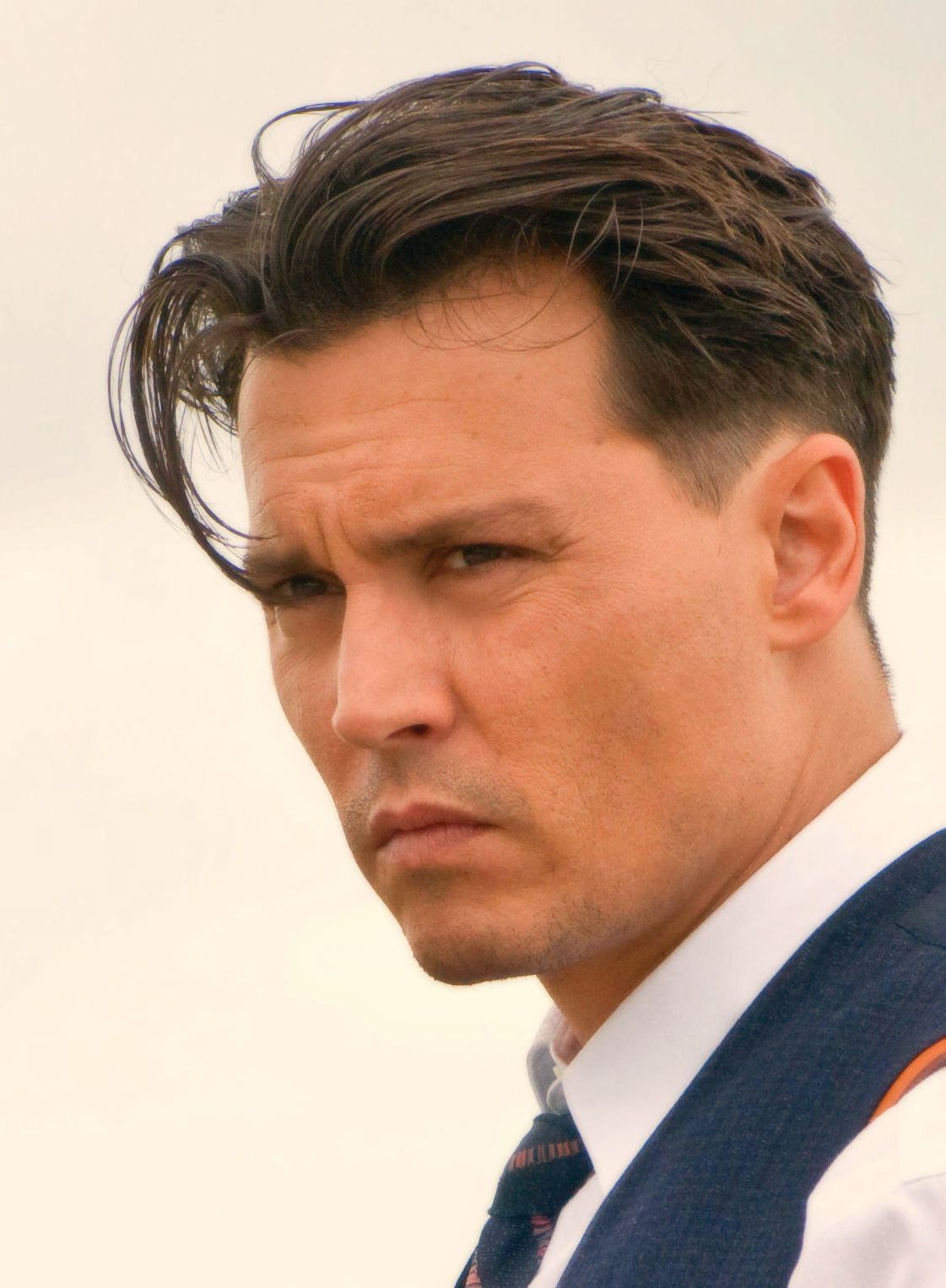 Slick back Johnny Depp hairstyle